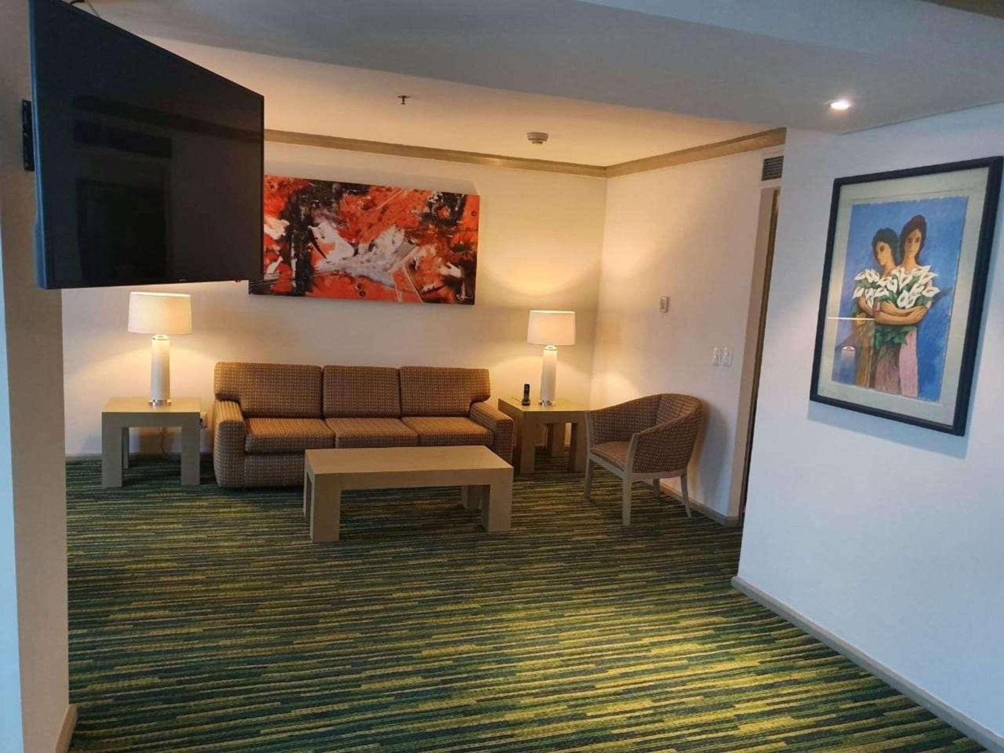 Radisson Paraiso Hotel Cidade do México Exterior foto A living room at the hotel